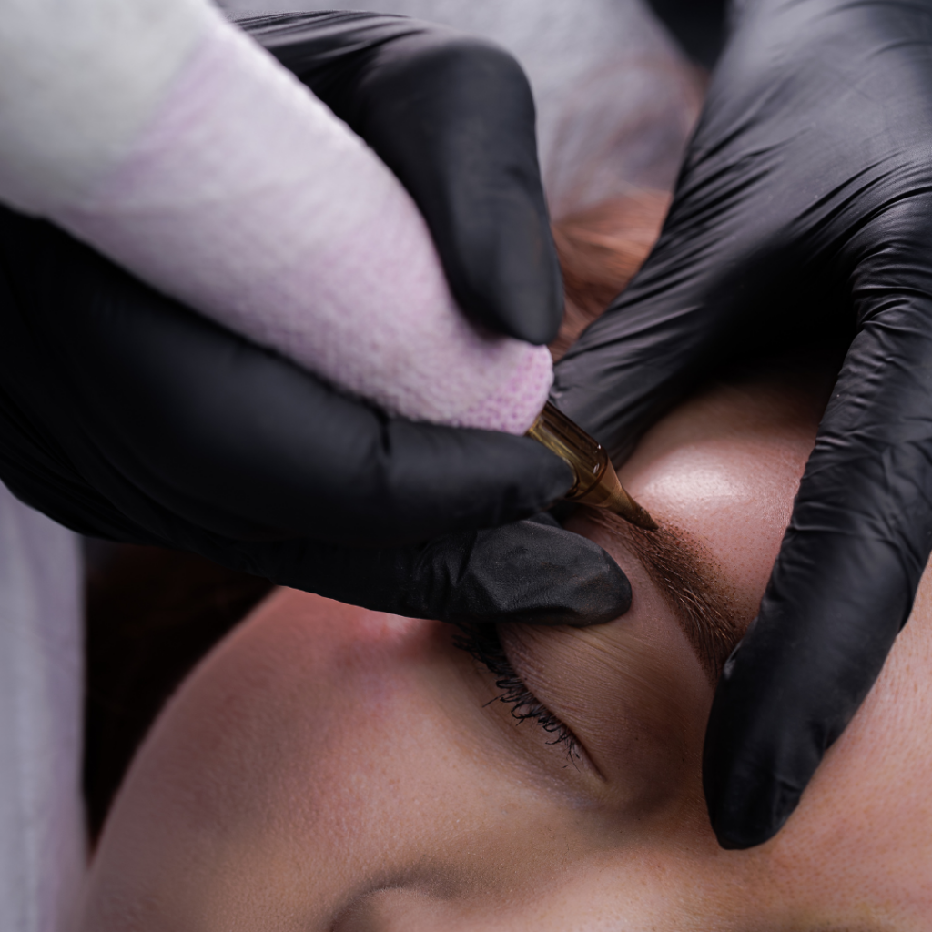 a person getting their eyebrows done in a salon (PMU)
