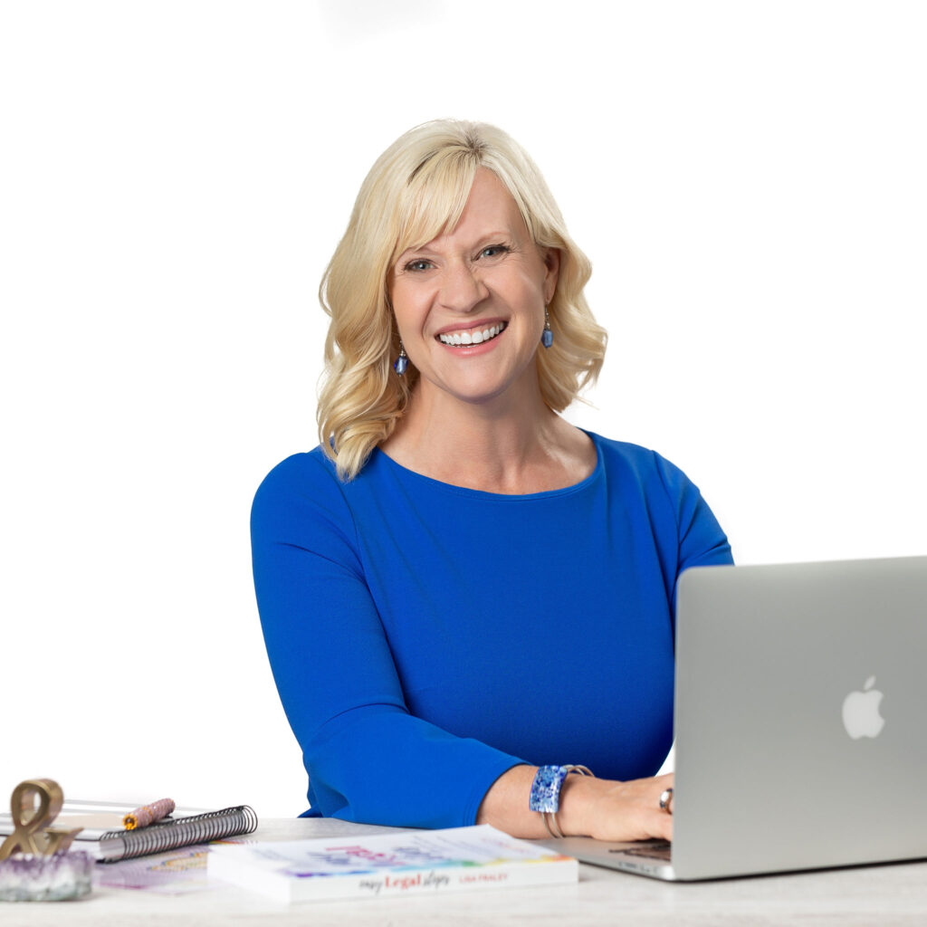 Headshot of Lisa Fraley stitting at a laptop