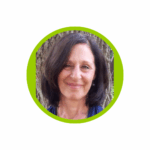 Judy ViaCava from Soulshine Empowerment Coaching's headshot, smiling in front of a tree