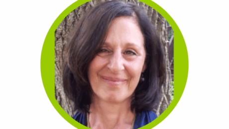 Judy ViaCava from Soulshine Empowerment Coaching's headshot, smiling in front of a tree