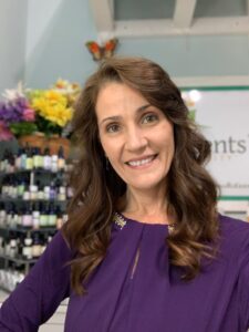 Jennifer Pressimone headshot in purple shirt