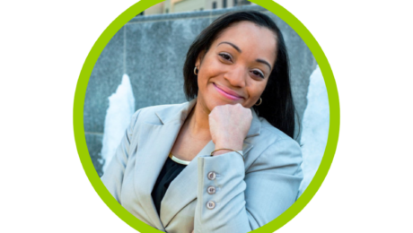 Dr Sophia Miranda in gray blazer, smiling with hand on chin in a green circle frame