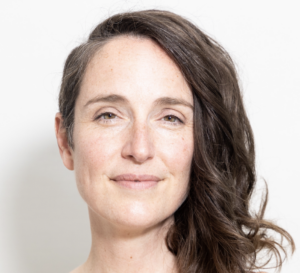 Headshot of Jennifer Martin smiling with hair to the right